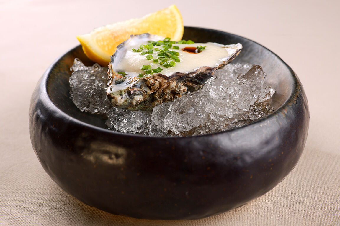 Oyster on ice with lemon.